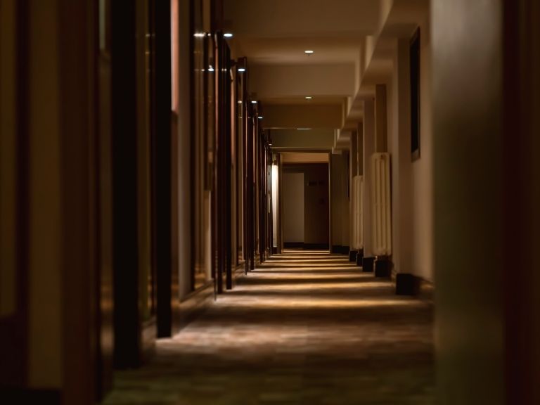 the corridor along hotel rooms